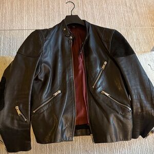 Black Leather Jacket with Zipper Accents